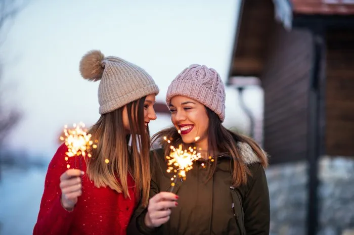 photo of impatient young women waiting for a holiday outdoors