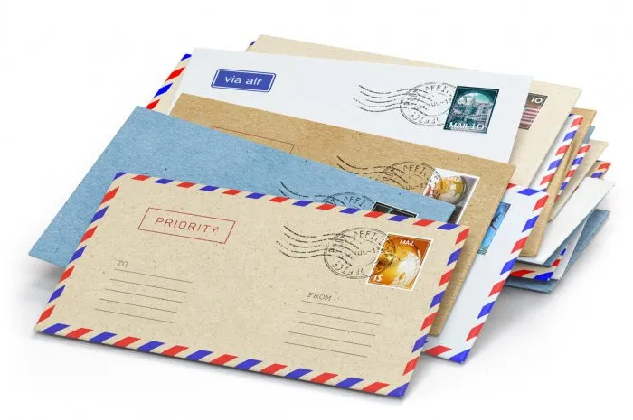 stack of paper letters with stamps isolated on white background 3d illustration