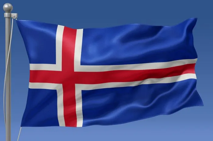 iceland flag waving on the flagpole on a sky background
