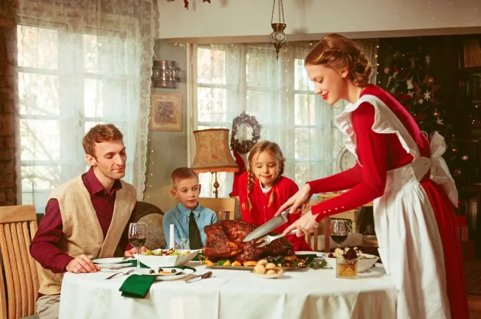 family having a holiday dinner together, 50s retro style