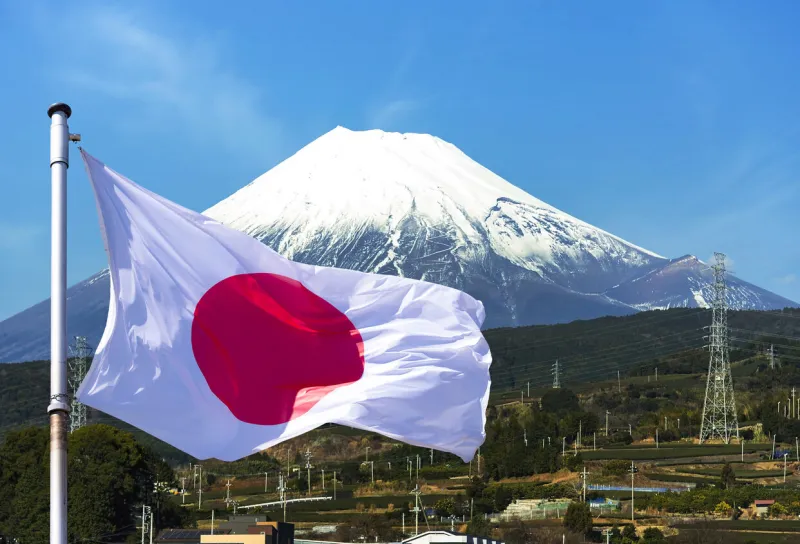 japan, mount fuji on the island of honshu and japan flag