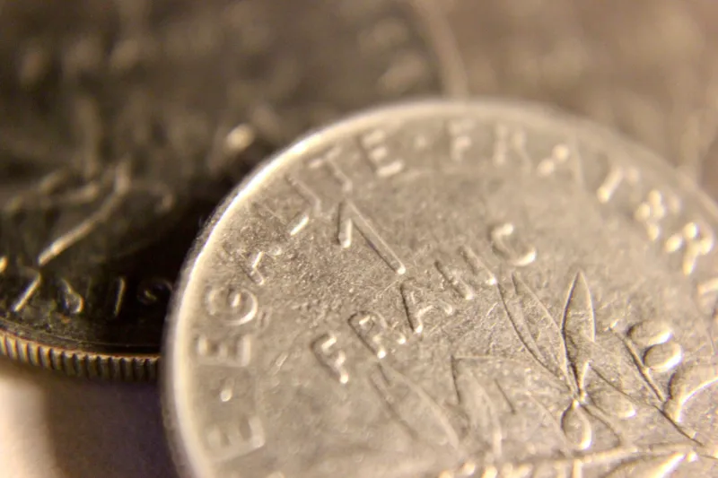 close up of a french 1 franc coin standing these coins are now obsolete since france adopted the euro as its official currency