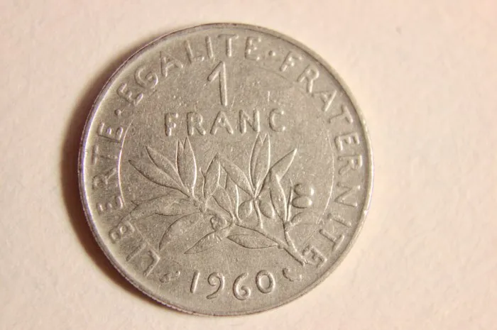close up of a french 1 franc coin these coins are now obsolete since france adopted the euro as its official currency