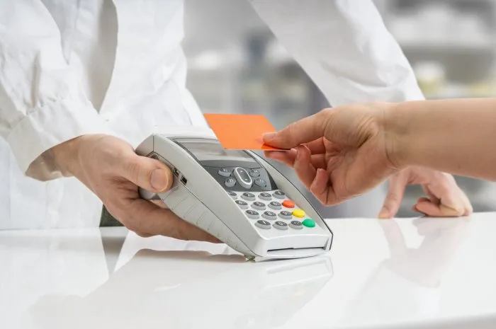 customer is paying with credit card in pharmacy
