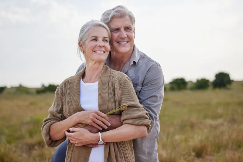 shot of a mature couple standing together on a farm