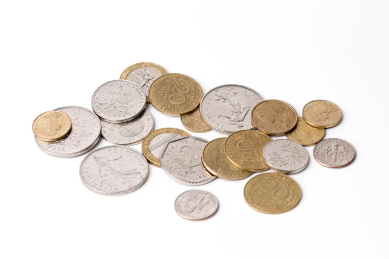 french francs coins on a white background, studio isolated