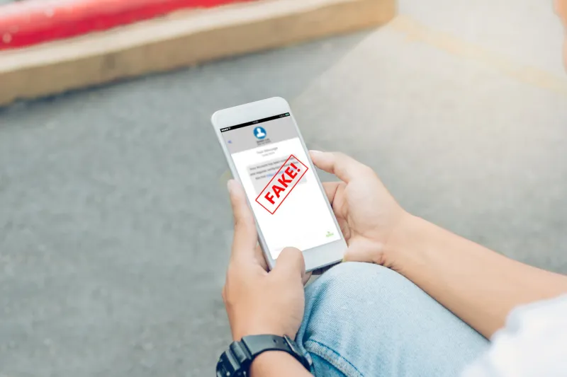 fake text message sms scam or phishing concept