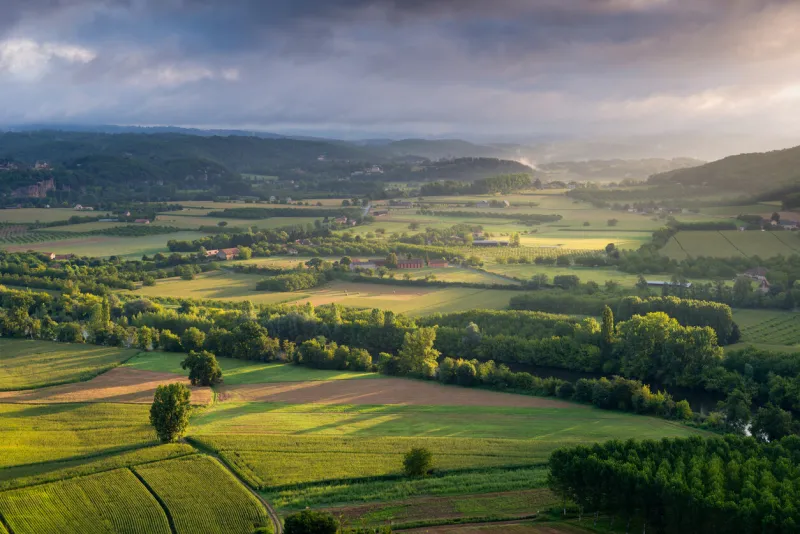view on the dordogne on a beautiful summer morning from the old village domme