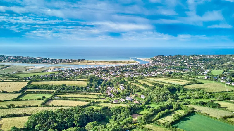 aerial image of carteret village, marina, estuary, sea and beach