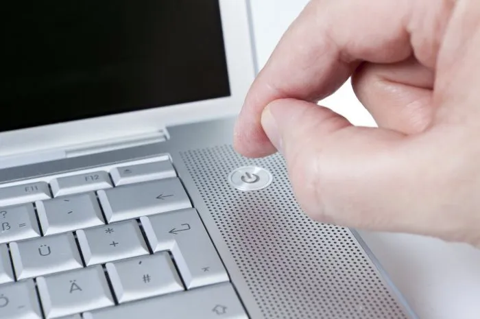 picture shows the activation of a power switch from a notebook