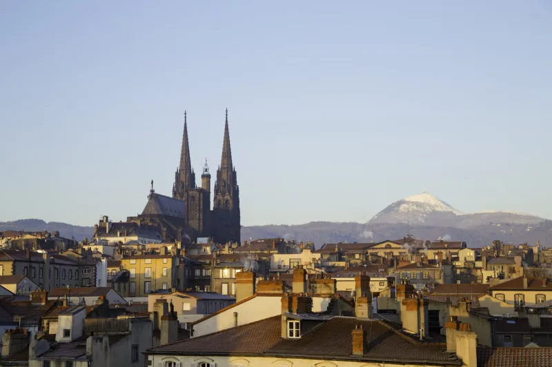 roof top view of city center and volcano puy de dome in clermont ferrand, auvergne, france