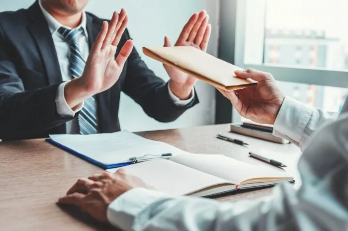 corruption and bribery,businessman manager refusing receive money from business man passing money dollar bills to deal contract