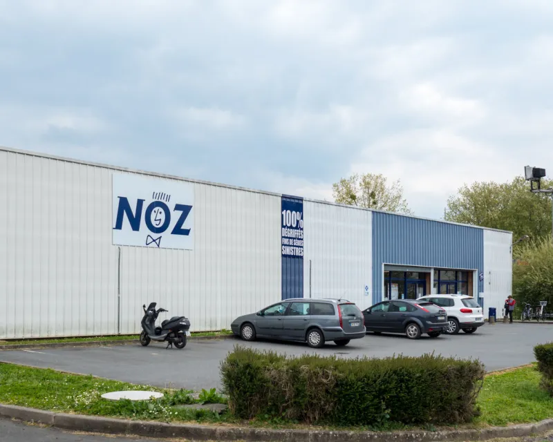 fleche, france – july 22, 2021  the noz in france  front view of french store boutique with logo and signage