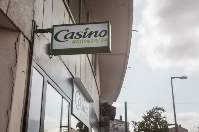 picture of a sign with the logo of casino on their local supermarket in lyon, france casino group or casino guichard-perrachon is a french mass-retail group of supermarkets, hypermarkets and convenience stores