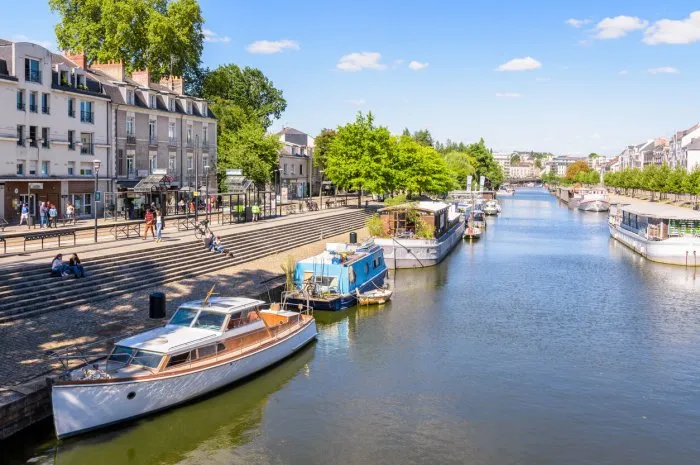 nantes, france - september 19, 2022  general view of the erdre river with houseboats and pleasure boats moored at dock on a sunny summer day