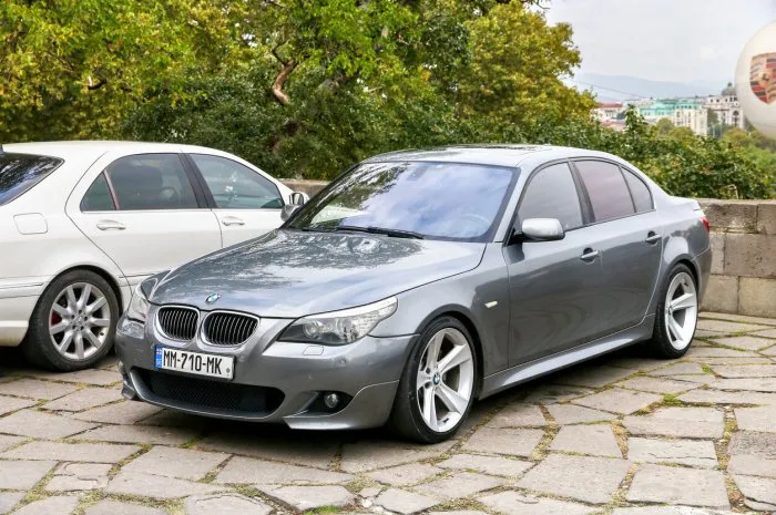 tbilisi, georgia - october 10, 2021  grey luxury sedan bmw 5-series (e60) in the city street