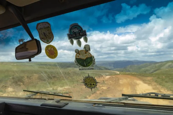 são roque de minas, mg, brazil, nov 03, 2018, off-road vehicle with stickers on the windshield travels on the road at the top of serra da canastra
