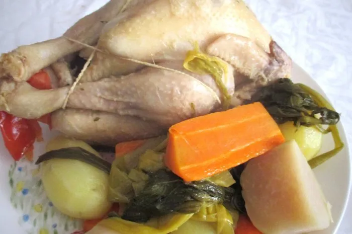 poule au pot chicken cooked in a broth with various vegetables  culture and french cuisine