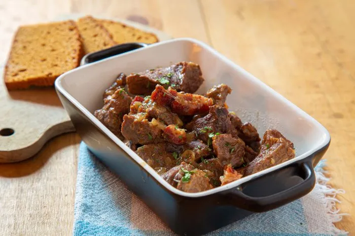 carbonade dish with gingerbread on a wooden table