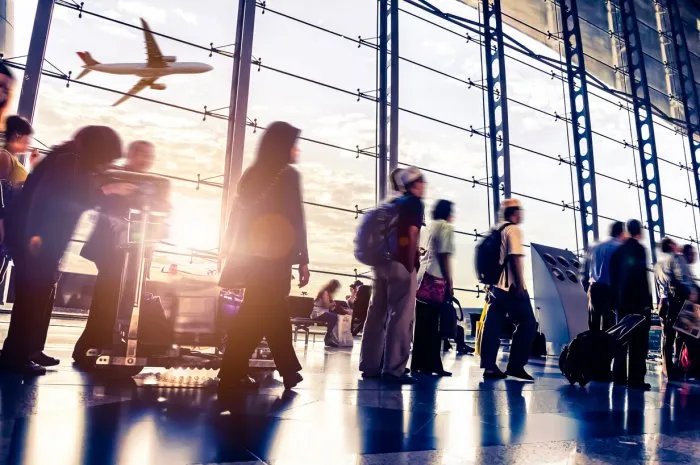 blurred shot of people walking through malaysia airport