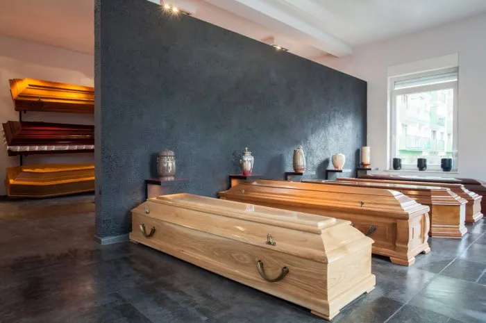 coffins standing in funeral house