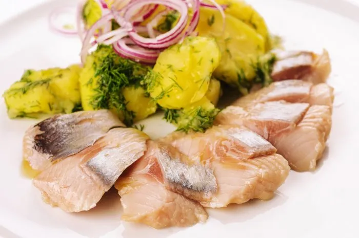 salted fish with boiled potato and pickled onions