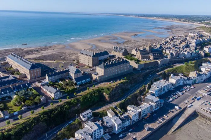 an aerial shot of the city of granville in france near the coasst