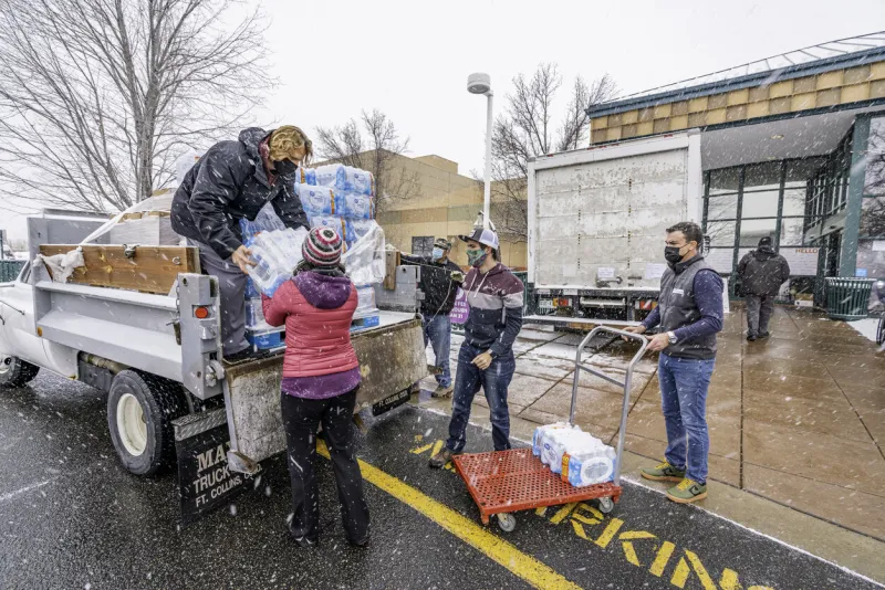 lafayette, co usa- december 31, 2021  volunteer's helping out the red cross at the ymca after the marshall fire ripped through louisville and superior, co