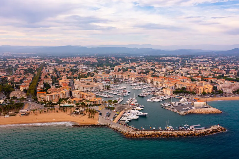 aerial cityscape of france city frejus with yachts in the harbor