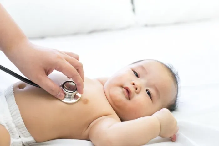 doctor exams asian newborn baby with stethoscope in the hospitaldoctor exams asian newborn baby with stethoscope in the hospital  sony a7