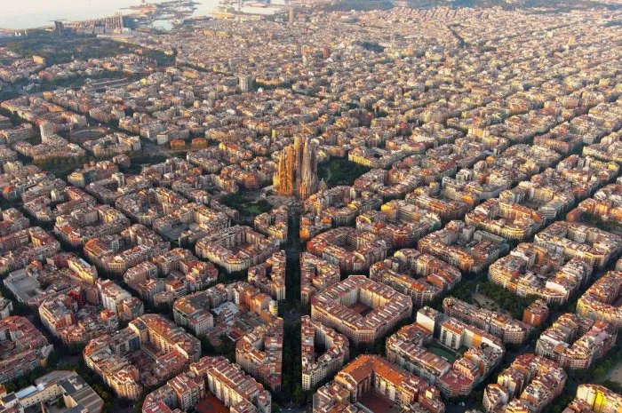 aerial view of barcelona eixample residential district and famous basilica sagrada familia at sunrise catalonia, spain