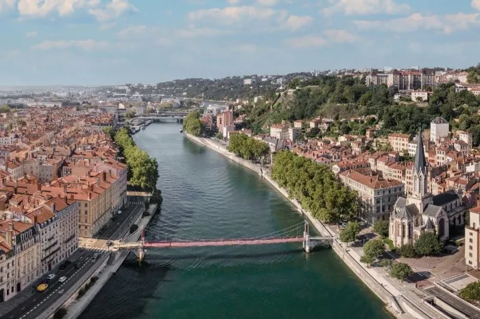 panorama of lyon, saint georges church and bridge over saone river, france
