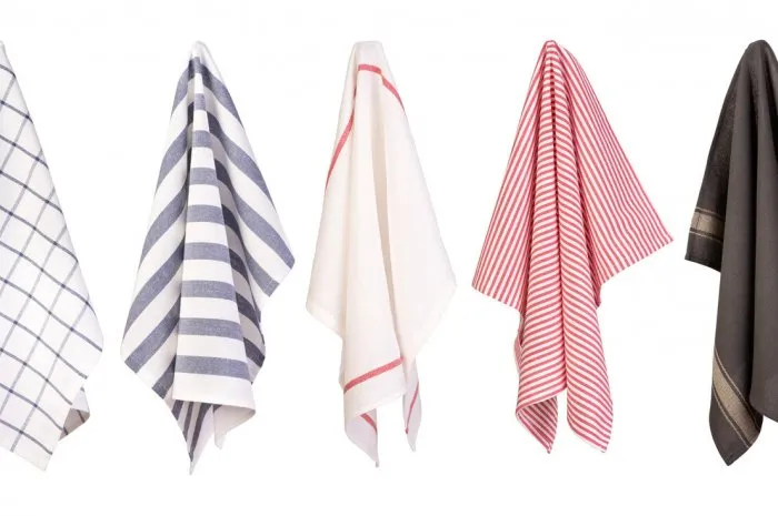 hanging dish towels isolated on white background, various colors and patterns