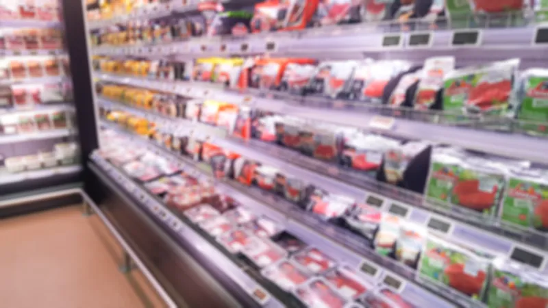 fresh supermarket interior in blurry background