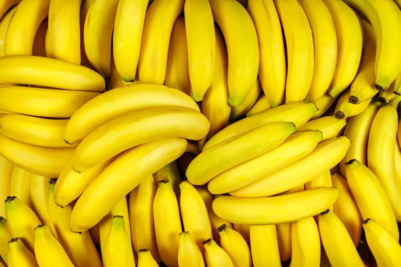 background of many banana pieces, overhead view, studio food photography macro