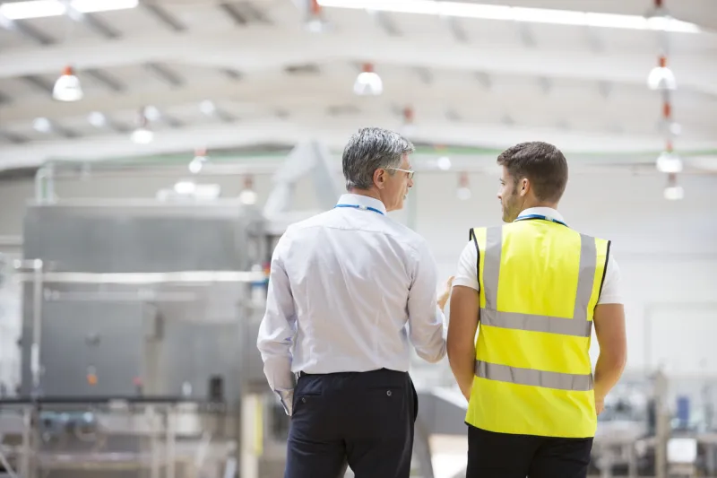 workers talking in warehouse