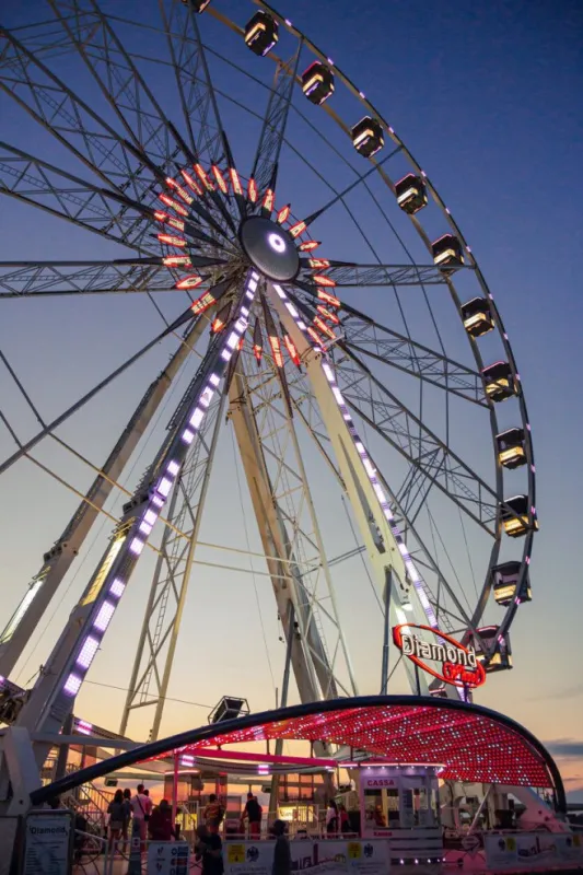 rimini, italy 14 july 2020 colorful ferris wheel at sunset at harbour of rimini, italy