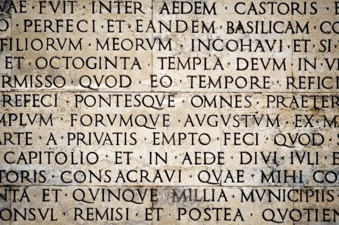 latin inscription on the outside wall of the peace altar in rome ara pacis wall in rome, italy