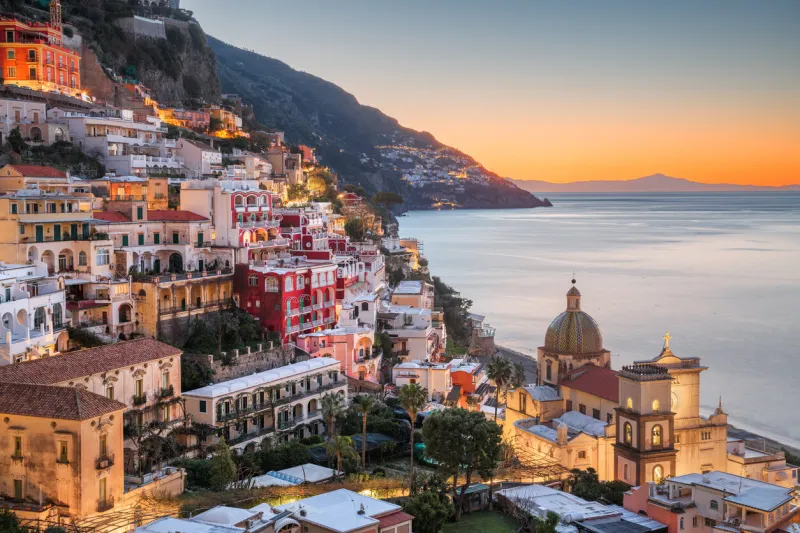 positano, italy along the amalfi coast at dusk