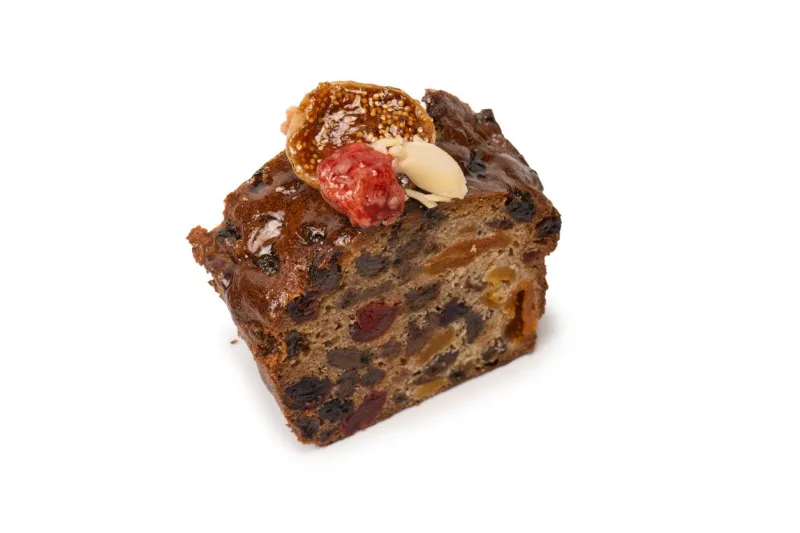 a cake with dried fruits, raisins almonds, dried strawberry, dried apricots