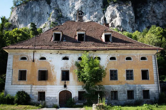 old abandoned house near a mountain