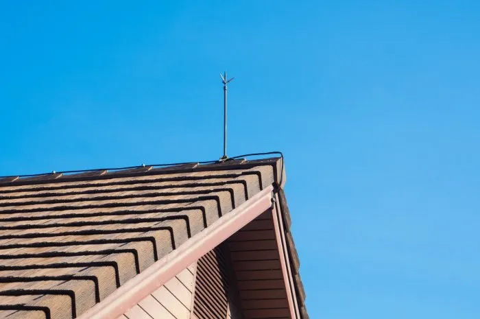 lightning rod for lightning protection is installed on the roof of the house