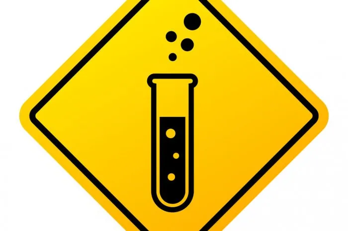 danger chemicals in test glass warning sign isolated on white background