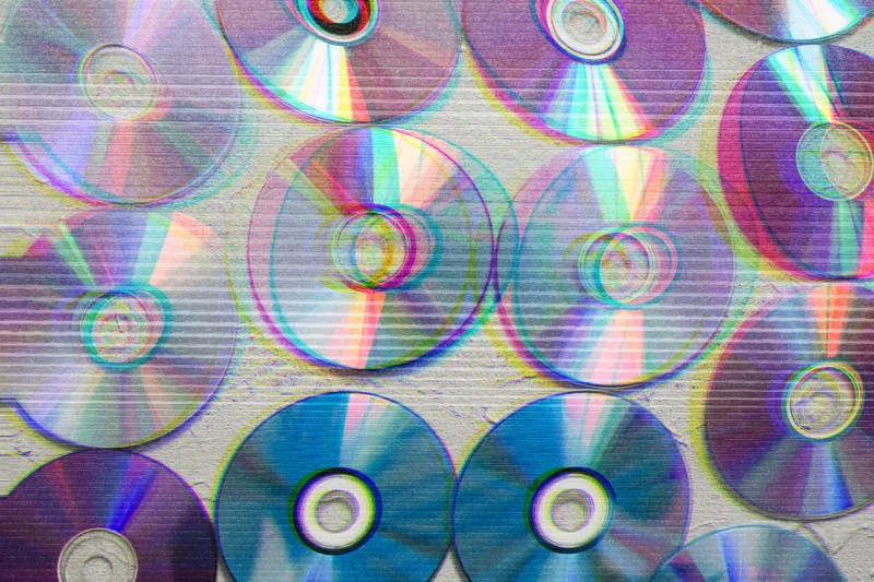 image of cd's with glitch effect, retro wallpaper, futuristic, color effect