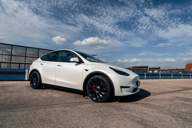 tesla model y performance parked on the top deck of a parking garage in augsburg, germany