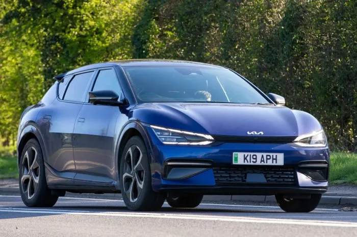 bicester,oxon, uk - april 7th 2023 2022 electric kia ev6 gt-line s awd car travelling on an english country road