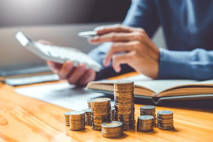 saving money concept man hand putting row and coin write finance saving money concept man hand putting row and coin write finance