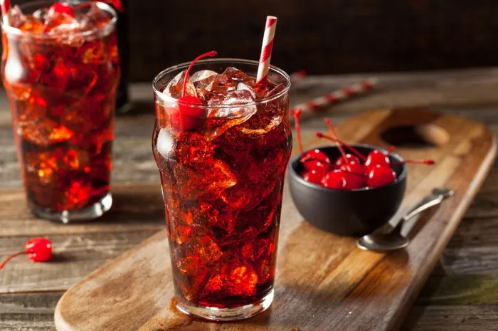 sweet refreshing cherry cola with garnish and straw