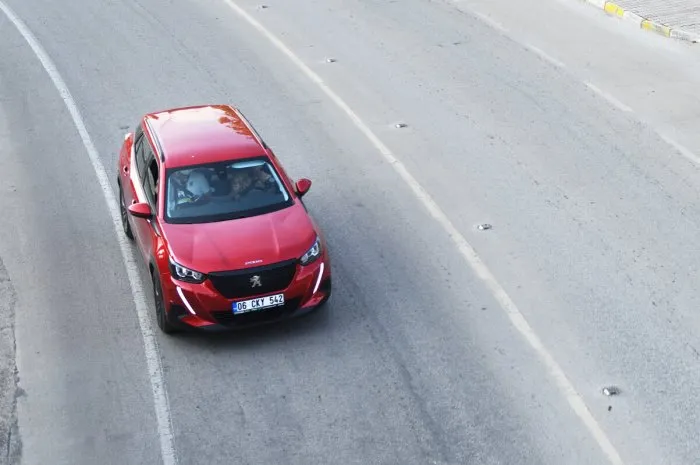 turkey, kemer 05182021 a red peugeot 3008 is moving down the street the 3008 is one of the most popular suvs   crossovers in europe