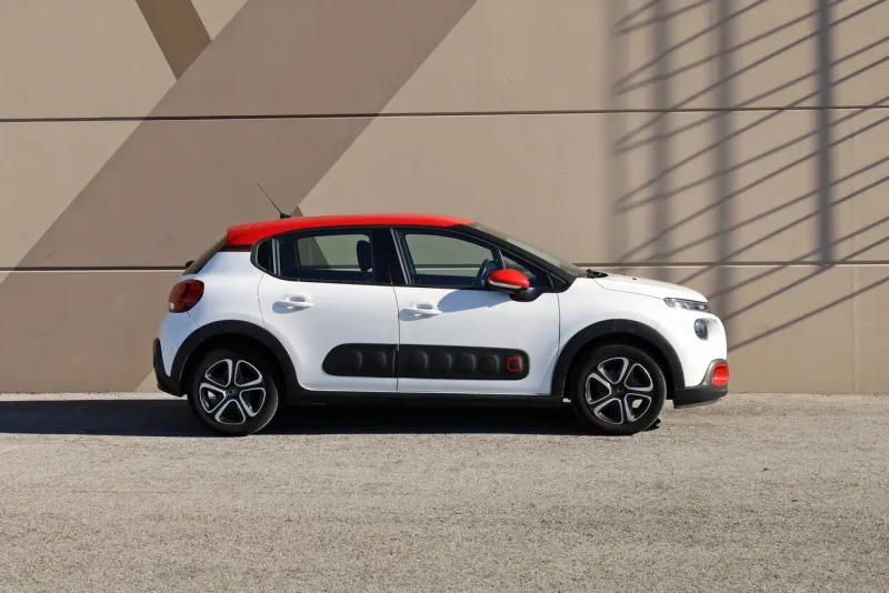 udine, italy november 6, 2022 new citroen c3 on brown painted wall background side view